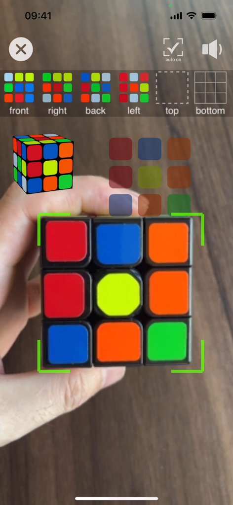 3D Magic Cube Solver - A hand holding a physical Rubiks cube being scanned by the 3D Magic Cube Solver app using AR camera technology