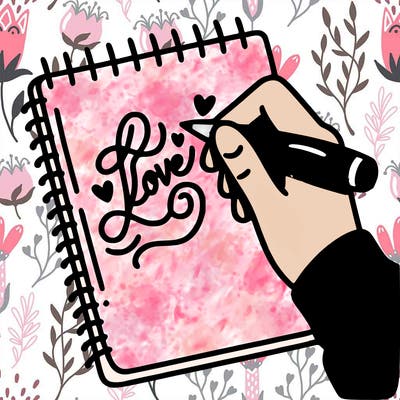 a hand writing “love” in calligraphy on a notebook