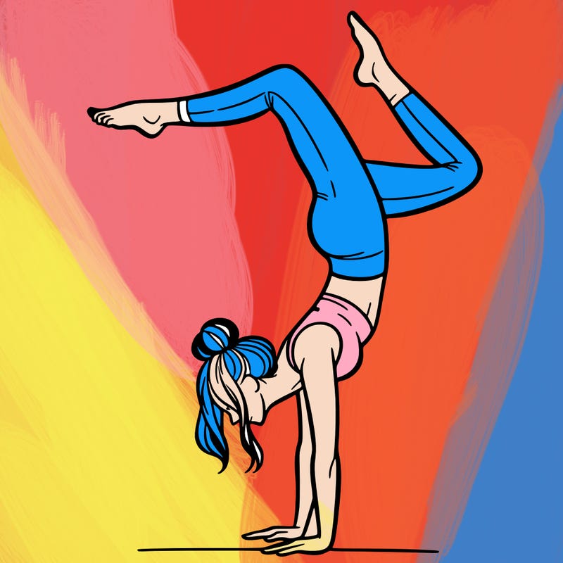 a woman doing a handstand