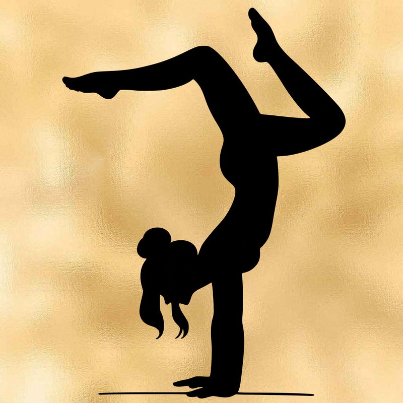 a woman doing a handstand