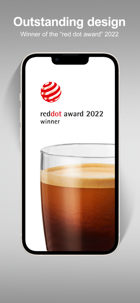 iPhone screen displaying the 2022 Red Dot Design Award logo and a fresh glass of espresso