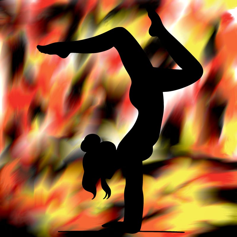 a woman doing a handstand