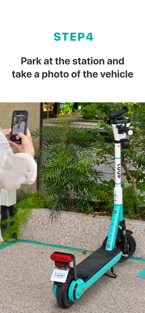 A user taking a photo of a parked LUUP e-scooter with their smartphone to complete the ride