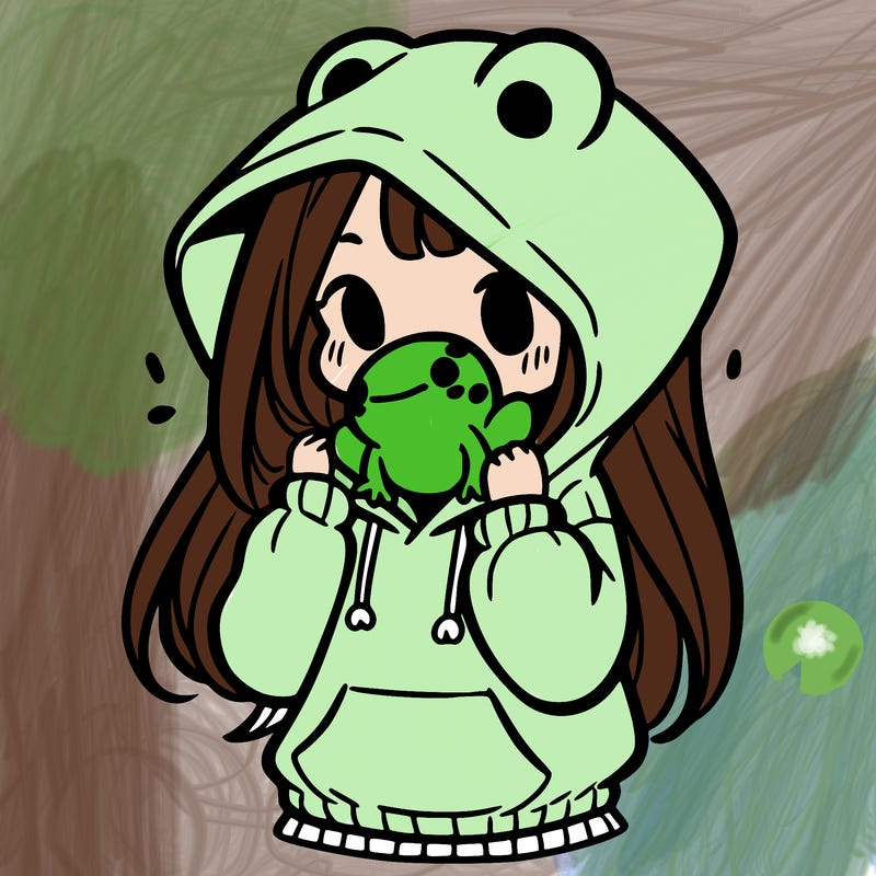 a girl holding a froggy hoodie