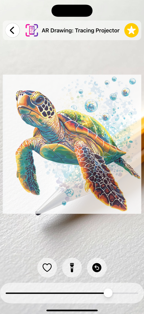 AR Drawing app showing a colorful sea turtle template being projected for tracing onto paper