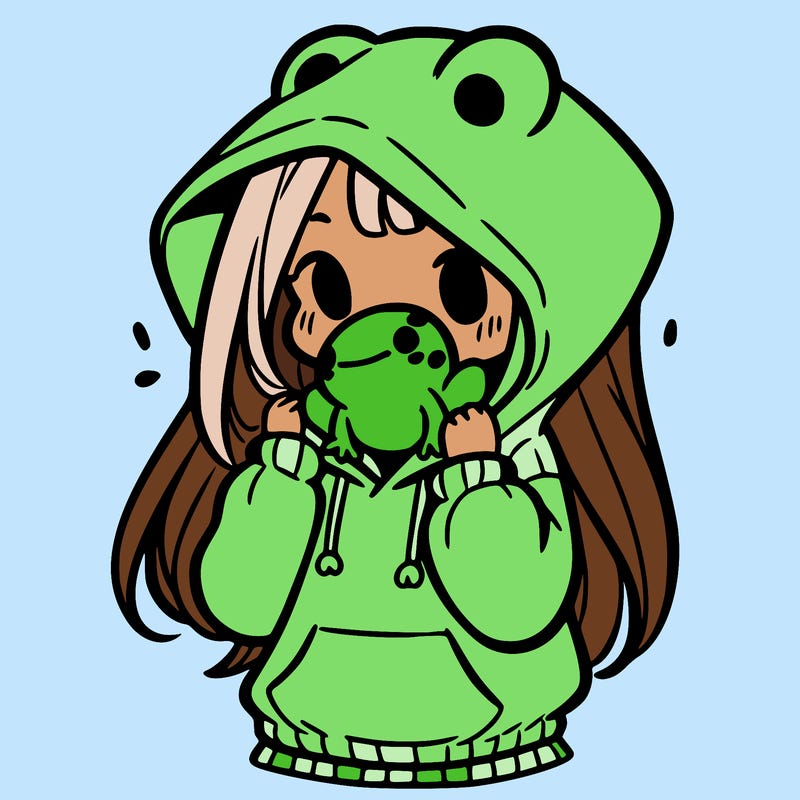 a girl holding a froggy hoodie