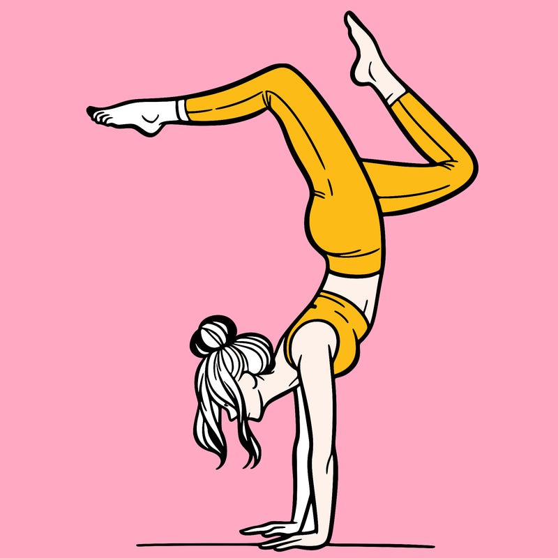 a woman doing a handstand