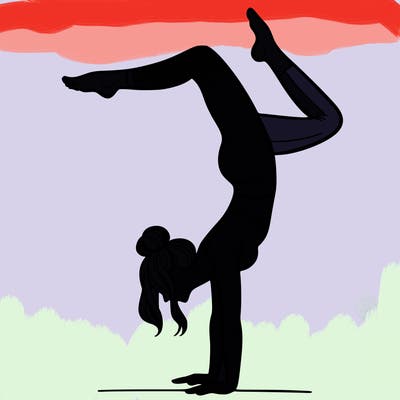 a woman doing a handstand