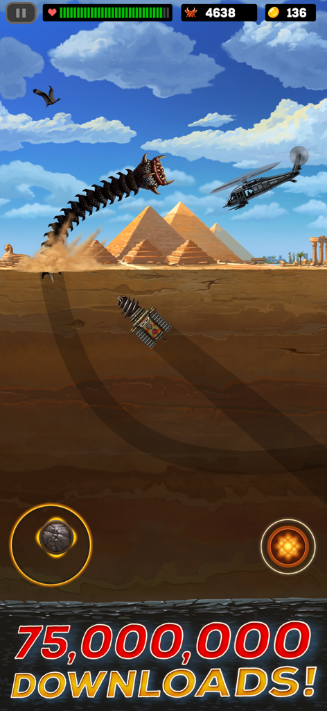 Death Worm™ Deluxe - A giant worm leaping from the sand to attack a helicopter in a desert level near pyramids