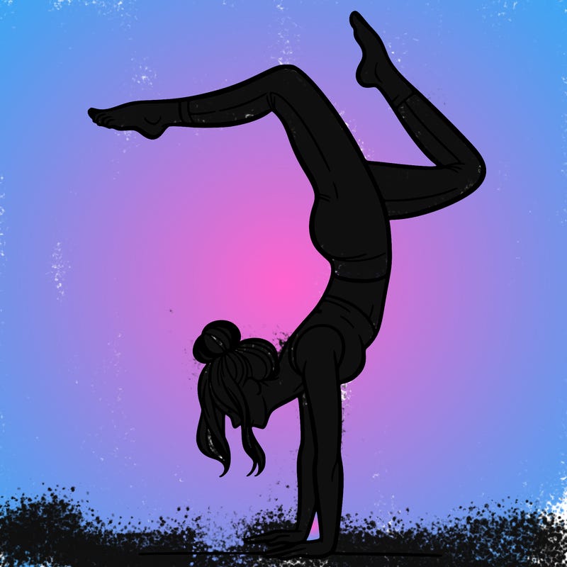 a woman doing a handstand