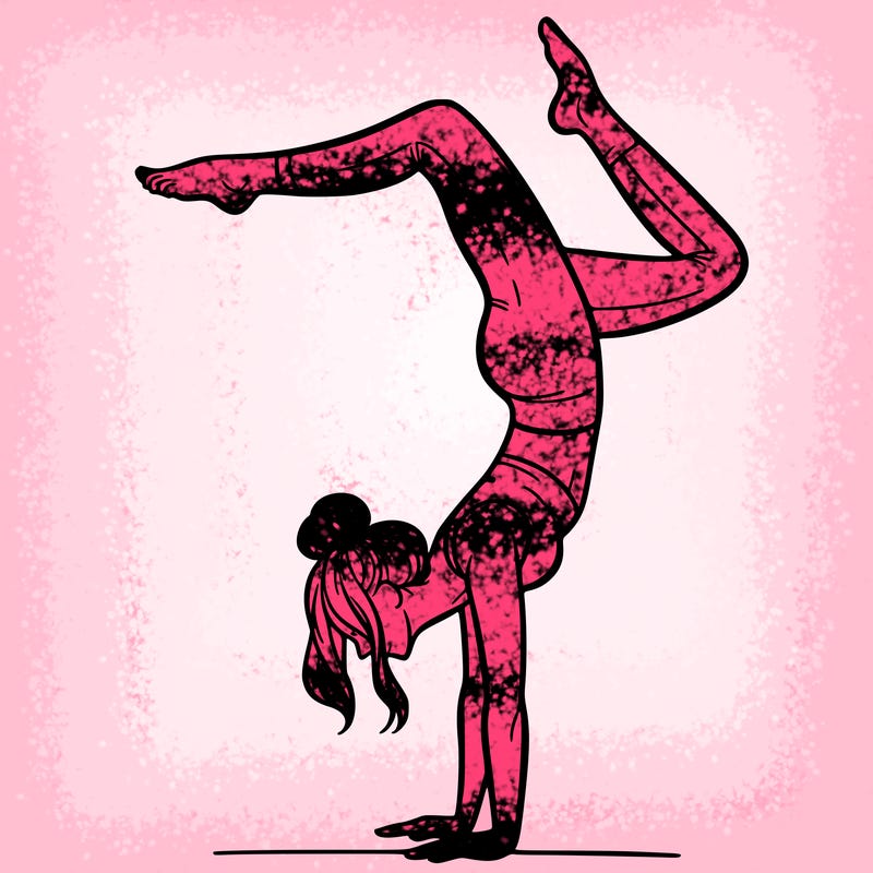 a woman doing a handstand