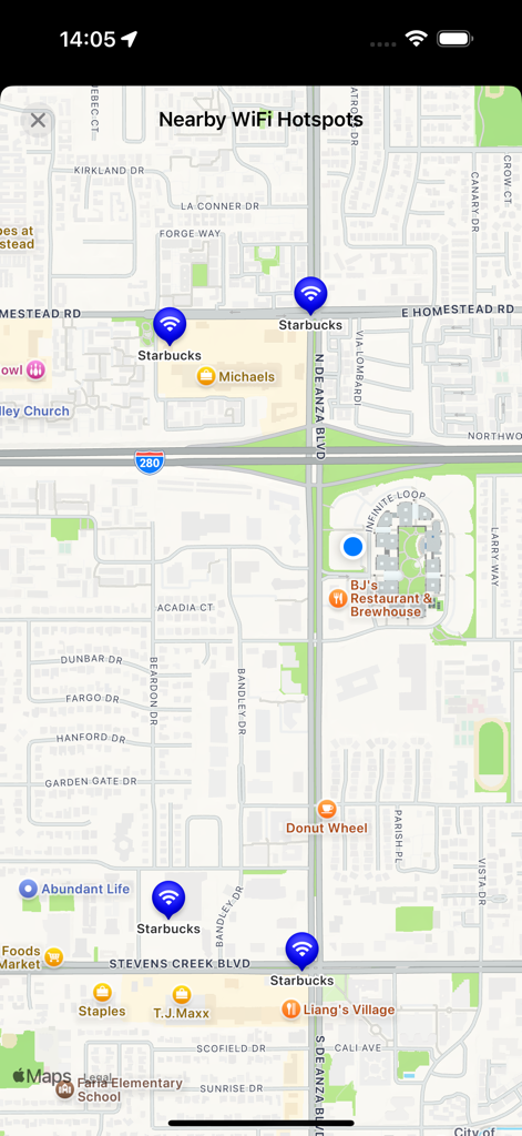 Free WiFi - Vue cartographique indiquant les points d'accès Wi-Fi gratuits à proximité, avec des marqueurs bleus chez Starbucks et dans les commerces locaux.