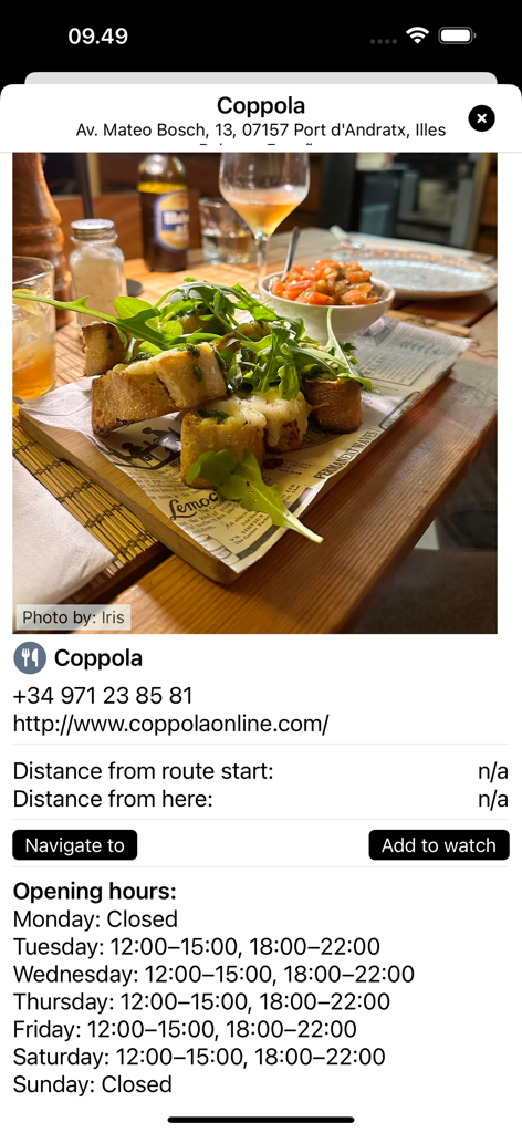 App screen showing restaurant details for Coppola in Mallorca with food photo and opening hours