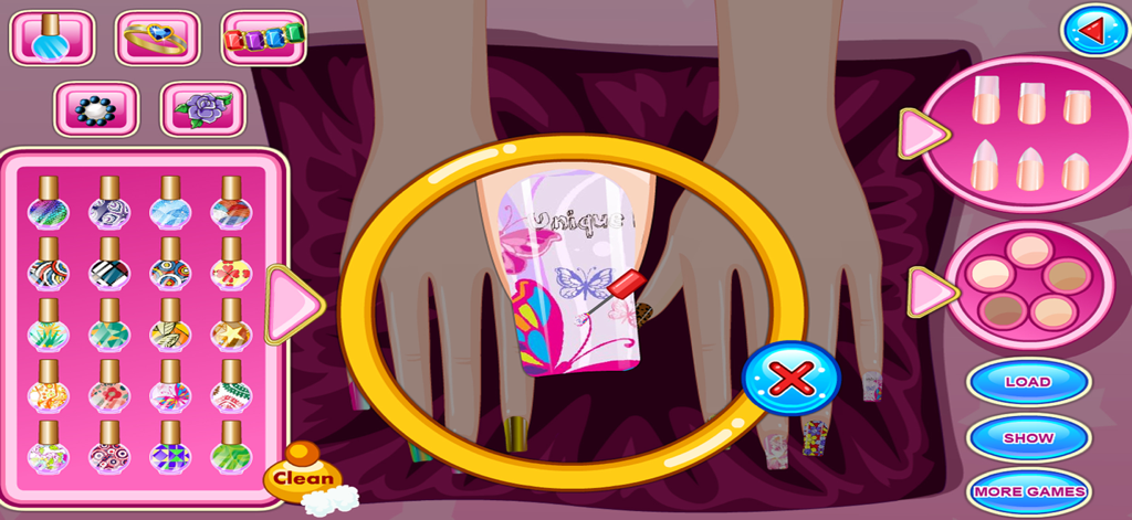 My Fashion Nail Salon Game - 私のファッションネイルサロンゲームのインターフェースで、鮮やかな蝶と花のパターンのネイルアートを爪に適用している様子。