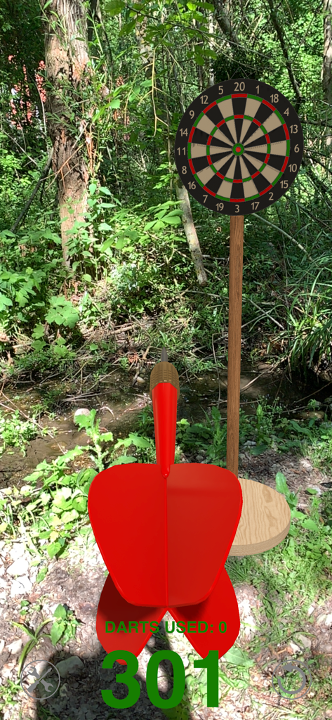 [AR] Darts - AR Darts gameplay showing a red dart and a dartboard in a forest environment
