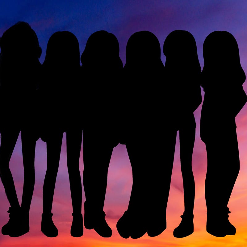 a group of girls wearing crop tops and shorts