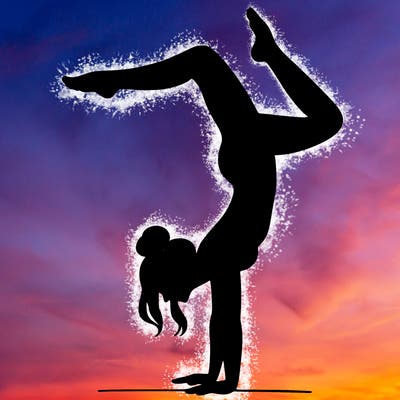 a woman doing a handstand