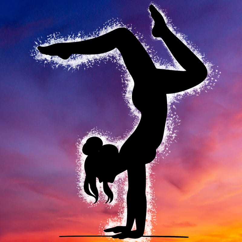 a woman doing a handstand
