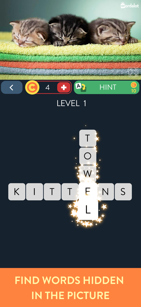 Wordalot – Picture Crossword - Capture d'écran du gameplay de Wordalot présentant un niveau de mots croisés avec des chatons endormis et des serviettes colorées.