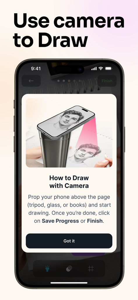 AR Drawing: Trace & Sketch Art - A tutorial screen in the AR Drawing app showing how to prop a phone to trace a portrait onto paper using the camera.