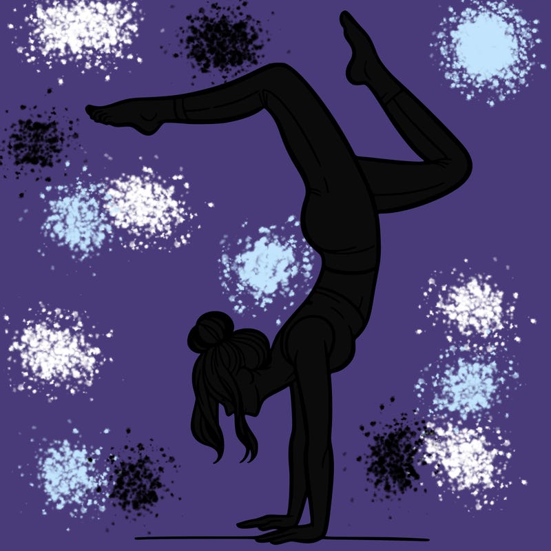 a woman doing a handstand