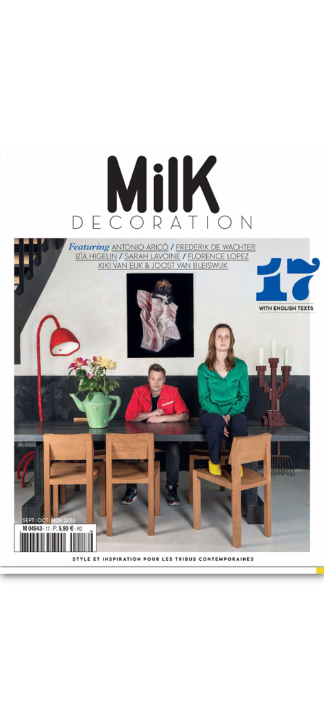 Milk Decoration - Cover of Milk Decoration magazine featuring a modern interior design with a couple seated at a wooden table