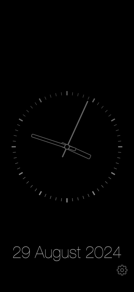 Minimalist analog clock display with date on a dark background in the Chime Clock app.