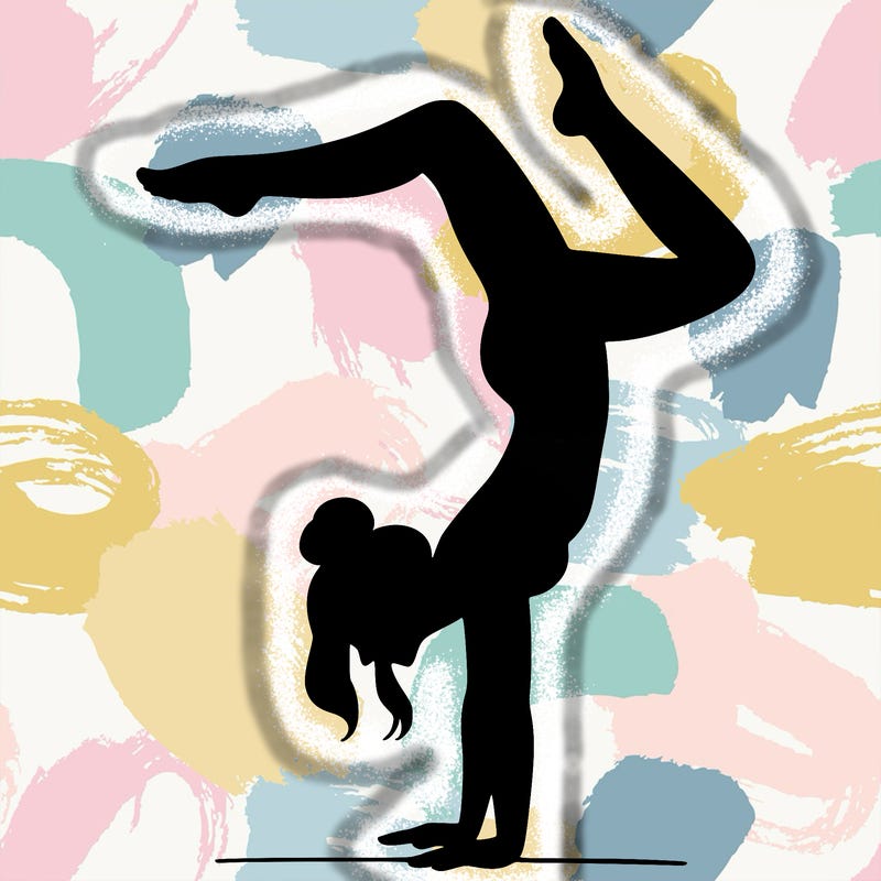 a woman doing a handstand