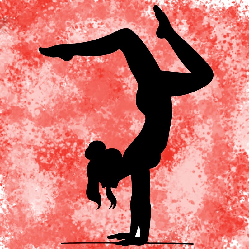 a woman doing a handstand