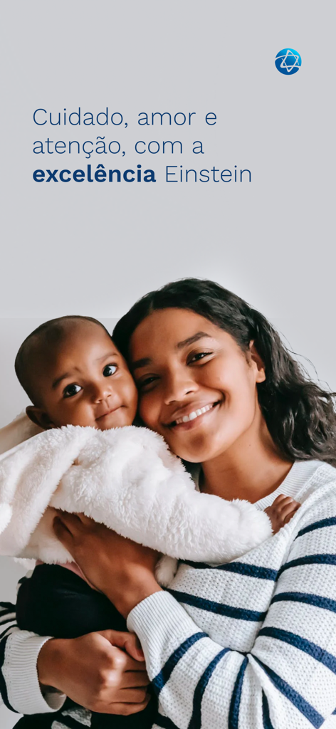 Meu Einstein - Smiling mother holding her baby showcasing the care and excellence of Albert Einstein hospital services.