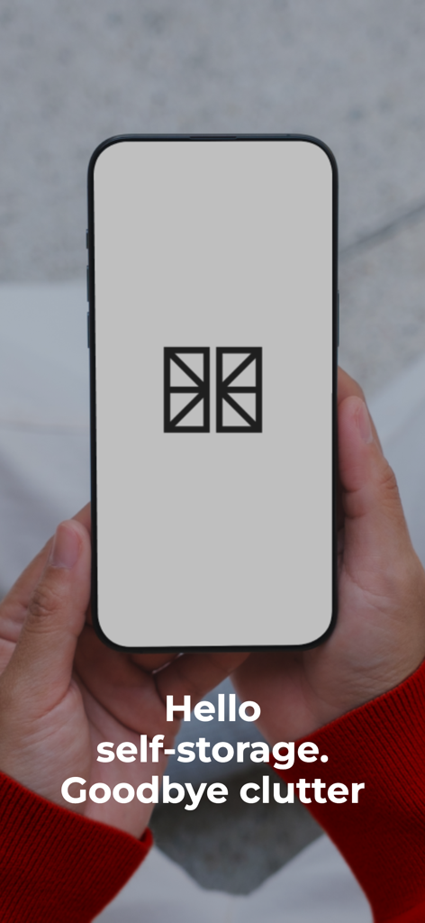 Hands holding a smartphone showing the Flexistore logo and the text Hello self-storage Goodbye clutter