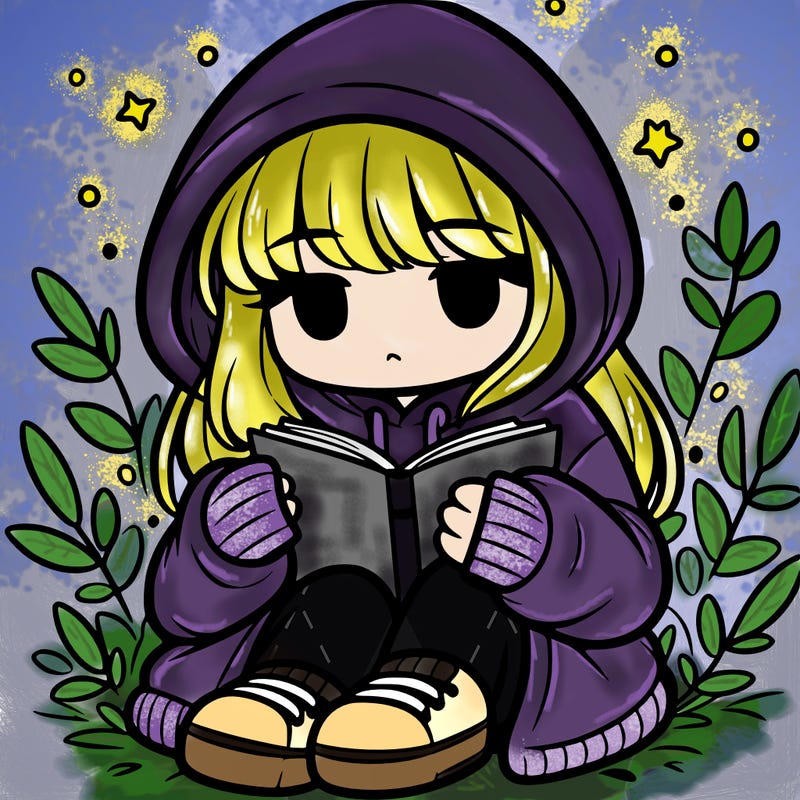 girl in oversized hoodie reading a book
