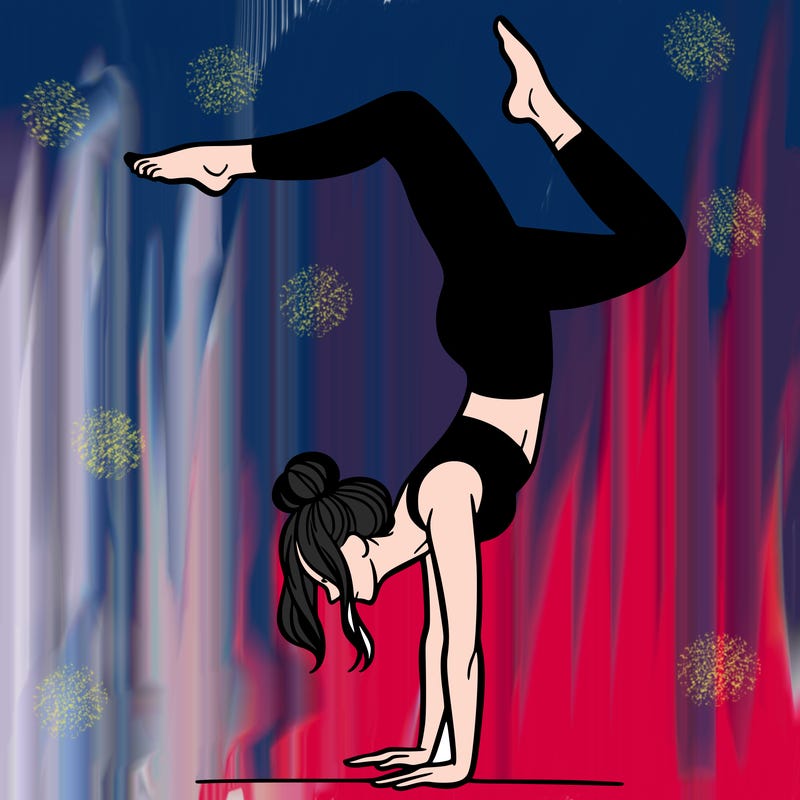 a woman doing a handstand