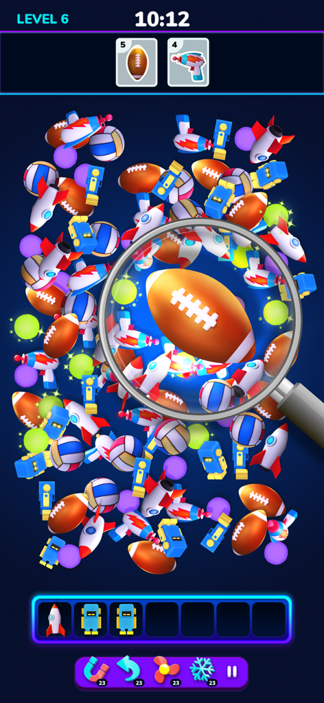 Blitz Factory 3D - A gameplay screenshot of Blitz Factory 3D showing a magnifying glass focusing on a 3D football amidst a pile of various objects like rockets and robots.