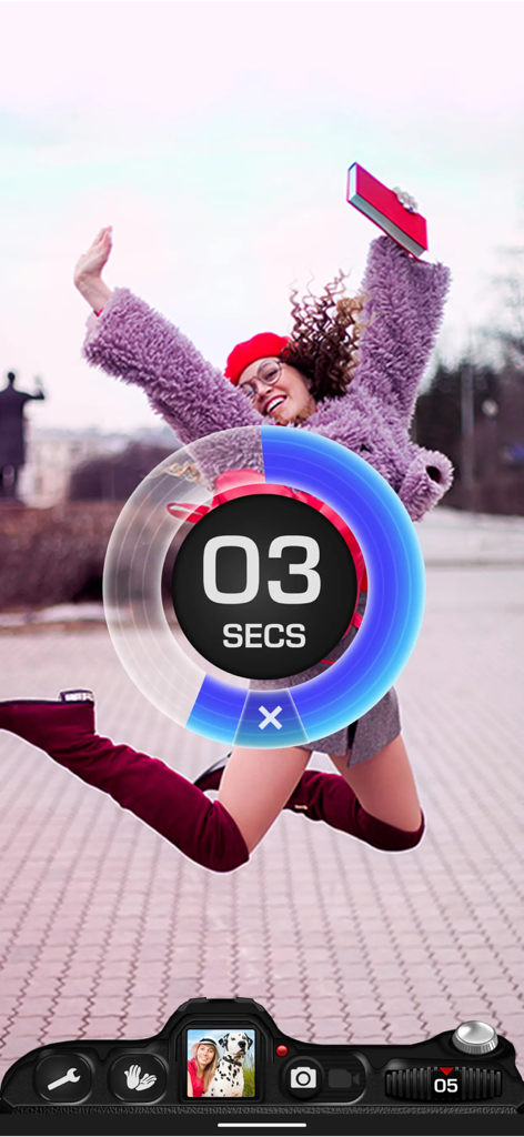 A woman jumping outdoors with a three second camera timer overlay from the Timer Auto Camera app