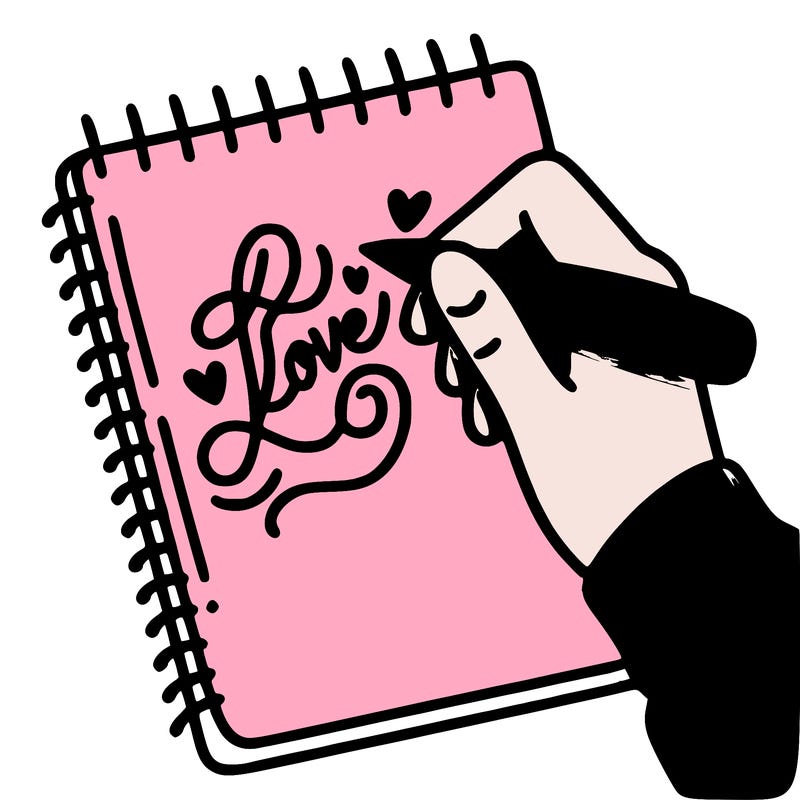 a hand writing “love” in calligraphy on a notebook