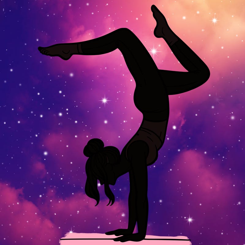 a woman doing a handstand