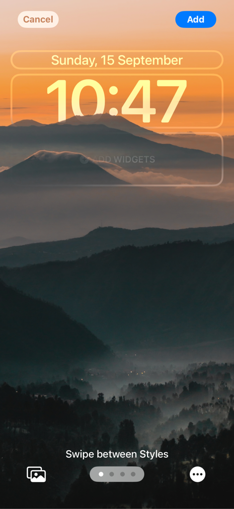 iPhone lock screen preview featuring a misty mountain landscape wallpaper with a golden sunset sky from the Walli app