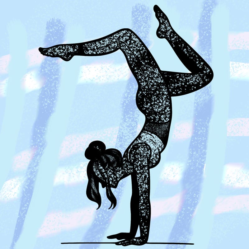a woman doing a handstand