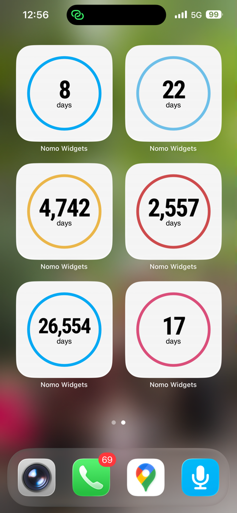 Nomo Widgets - An iPhone home screen featuring six colorful Nomo sobriety clock widgets displaying different day counts.
