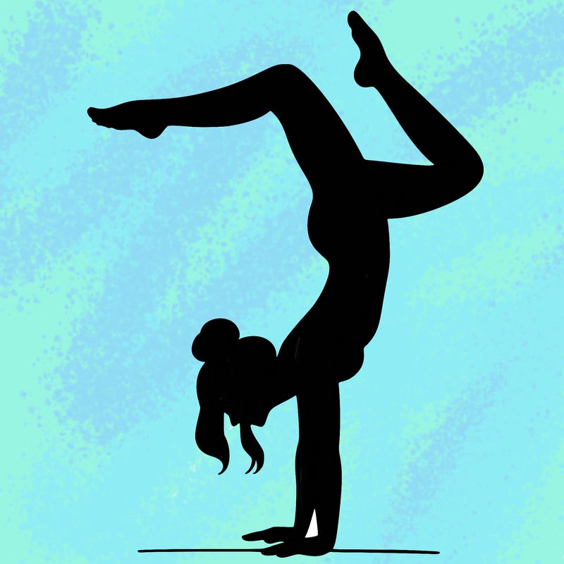 a woman doing a handstand
