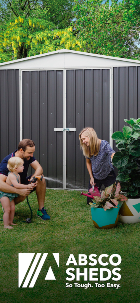 Absco Sheds Assembly App - A family gardening and playing together in front of a large grey Absco shed in their backyard