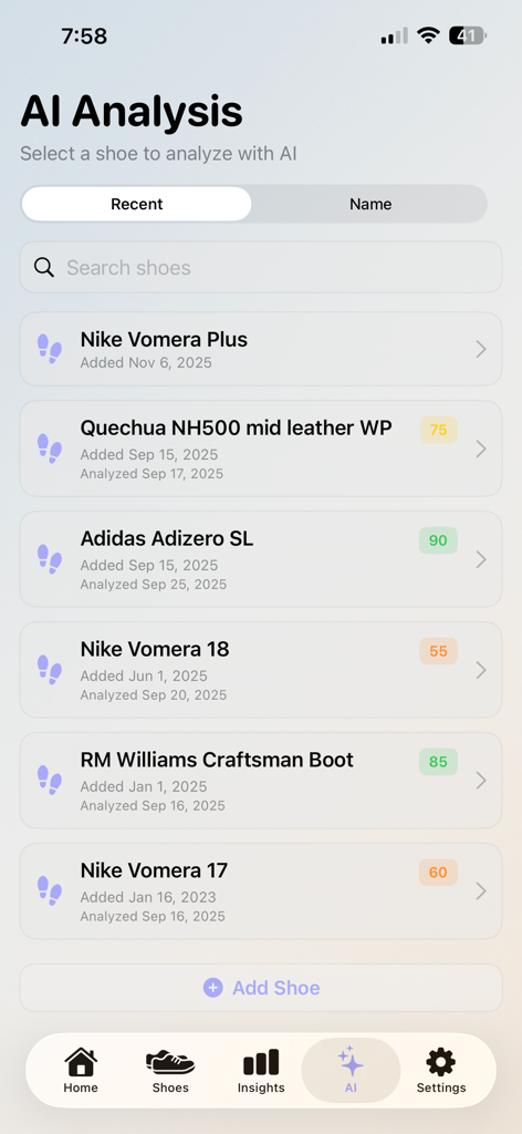 ShoeTrack - ShoeTrack mobile app screen showing AI analysis results and wear scores for various running and work shoes.