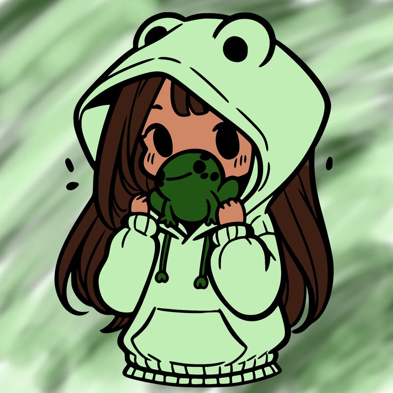 a girl holding a froggy hoodie