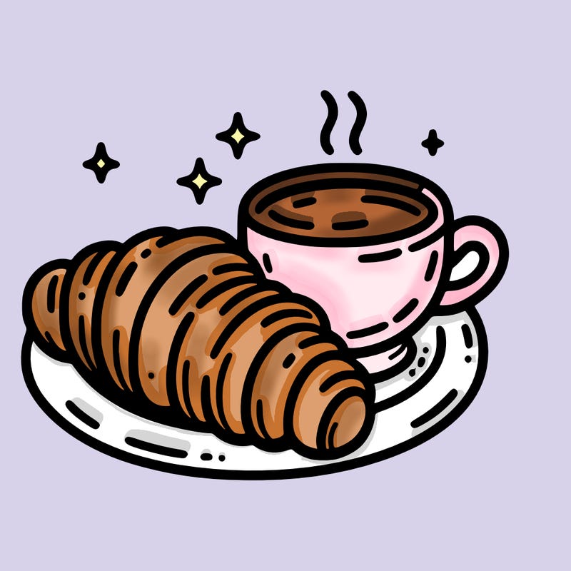 a croissant and a hot coffee placed on a plate