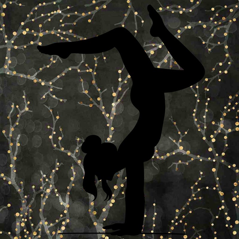 a woman doing a handstand