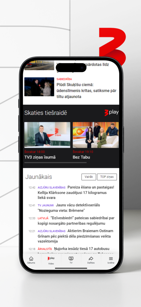 tv3.lv - tv3.lvモバイルアプリのインターフェースのスクリーンショット。ラトビアのニュースフィードとライブTVオプションが表示されています。