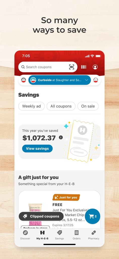 My H-E-B app savings page showing digital coupons and annual savings total