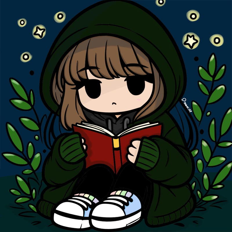 girl in oversized hoodie reading a book