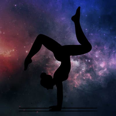 a woman doing a handstand